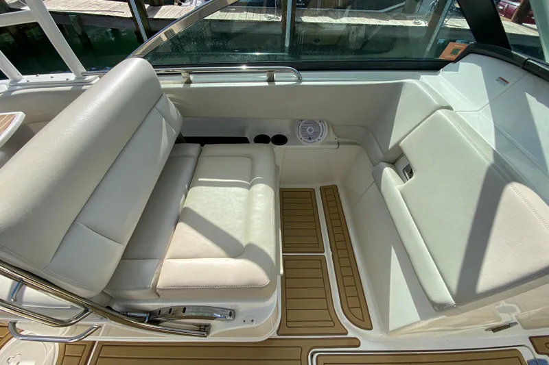  Yacht Photos Pics 2019 Boston Whaler 270 Vantage interior with white seating and teak-style flooring.