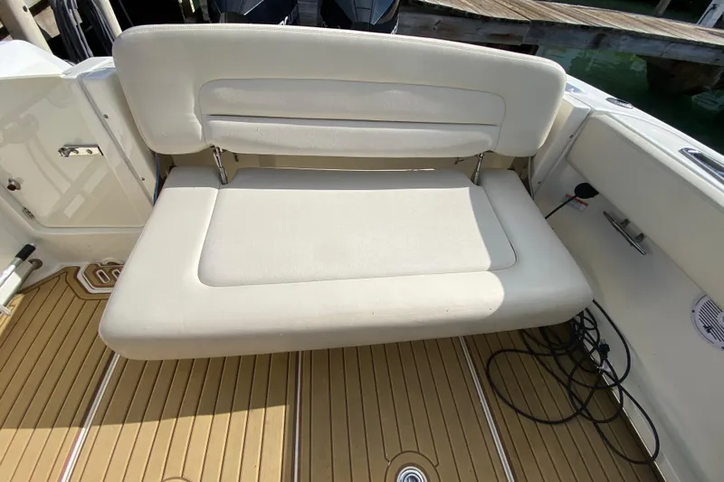  Yacht Photos Pics 2019 Boston Whaler 270 Vantage boat with foldable seating and teak flooring.