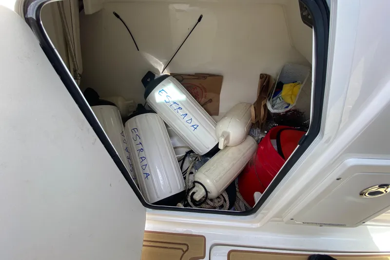  Yacht Photos Pics Storage compartment of 2019 Boston Whaler 270 Vantage with boat fenders and equipment.