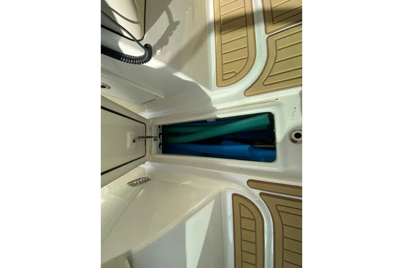  Yacht Photos Pics 2019 Boston Whaler 270 Vantage storage compartment with marine equipment.