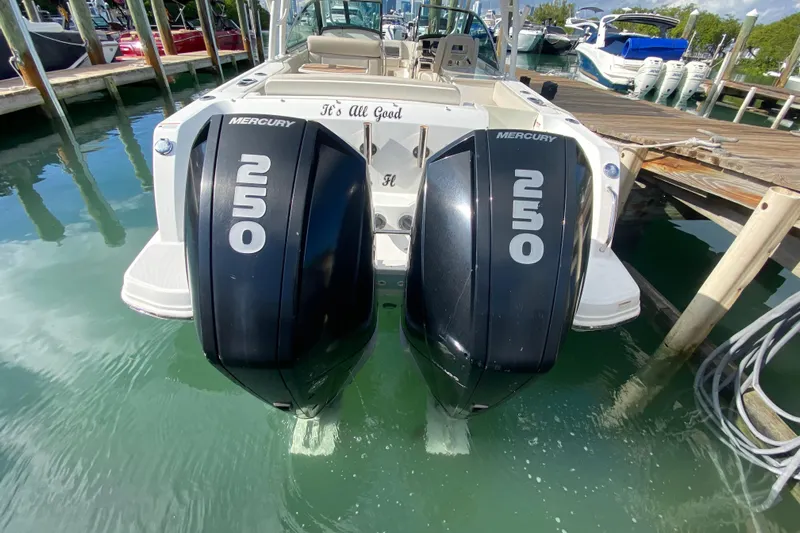  Yacht Photos Pics 2019 Boston Whaler 270 Vantage with twin Mercury 250 engines docked in marina.