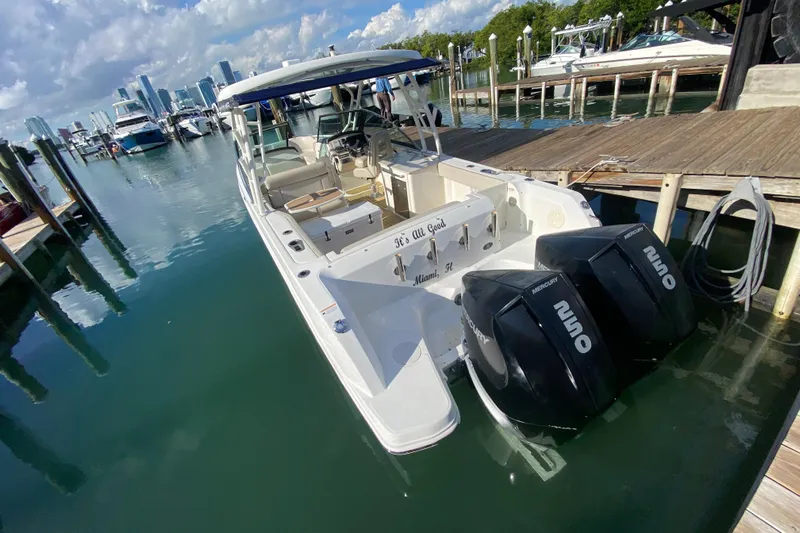  Yacht Photos Pics 2019 Boston Whaler 270 Vantage docked in marina with twin Mercury engines.