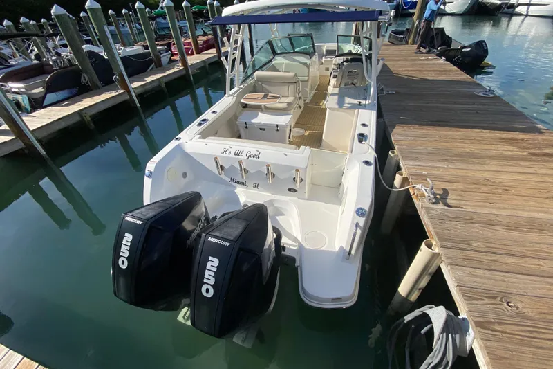  Yacht Photos Pics 2019 Boston Whaler 270 Vantage docked, featuring dual Mercury outboard engines.