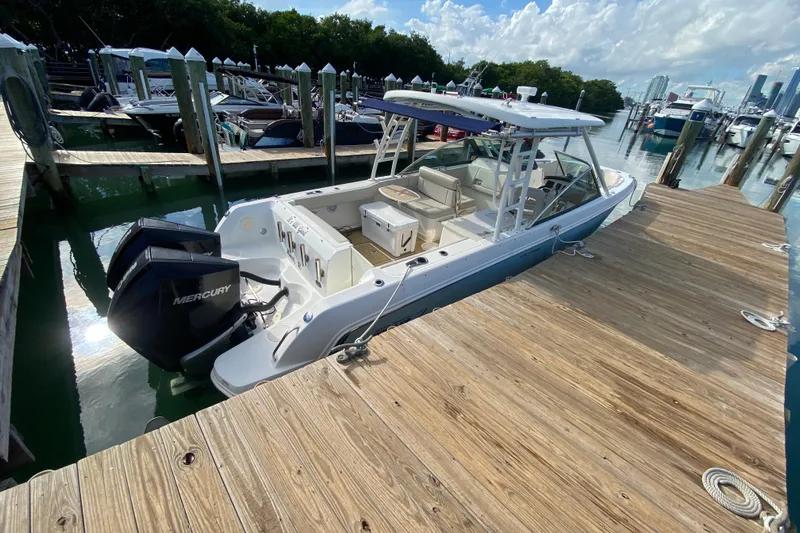  Yacht Photos Pics 2019 Boston Whaler 270 Vantage docked, featuring dual Mercury engines.