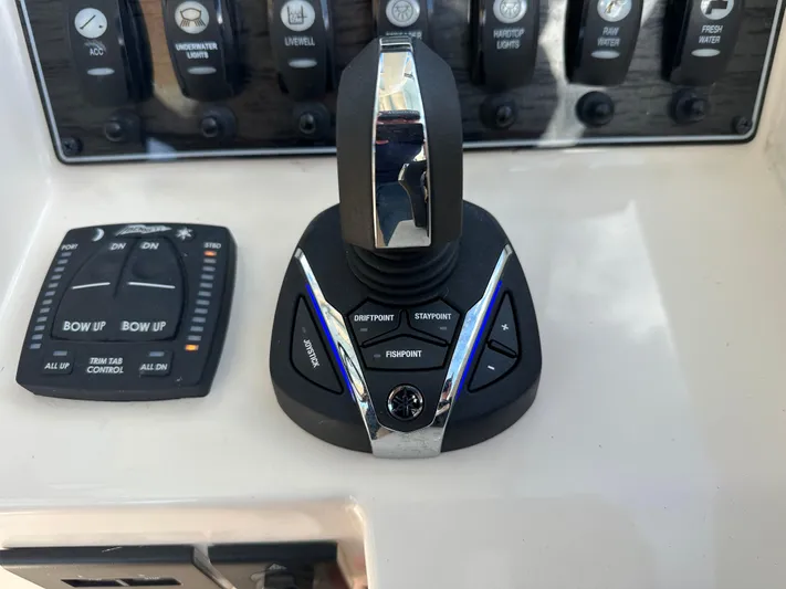  Yacht Photos Pics Control panel of 2024 Grady-White Freedom 285 boat with joystick and trim tab controls.