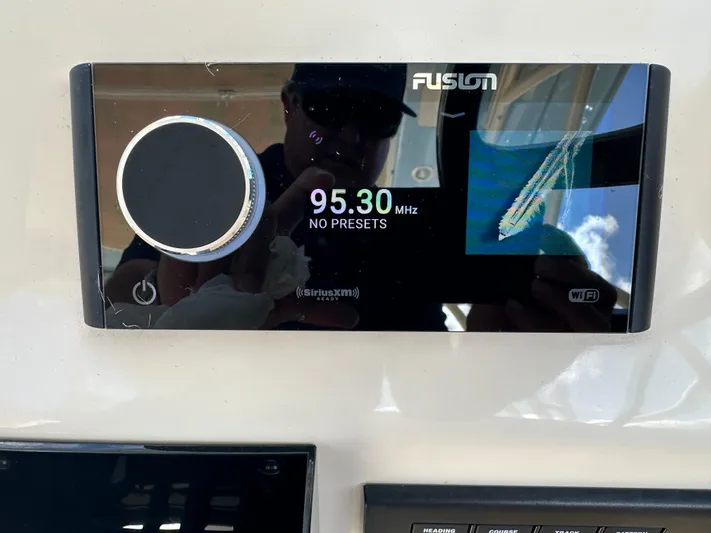  Yacht Photos Pics Fusion marine stereo display on 2024 Grady-White Freedom 285 boat dashboard.