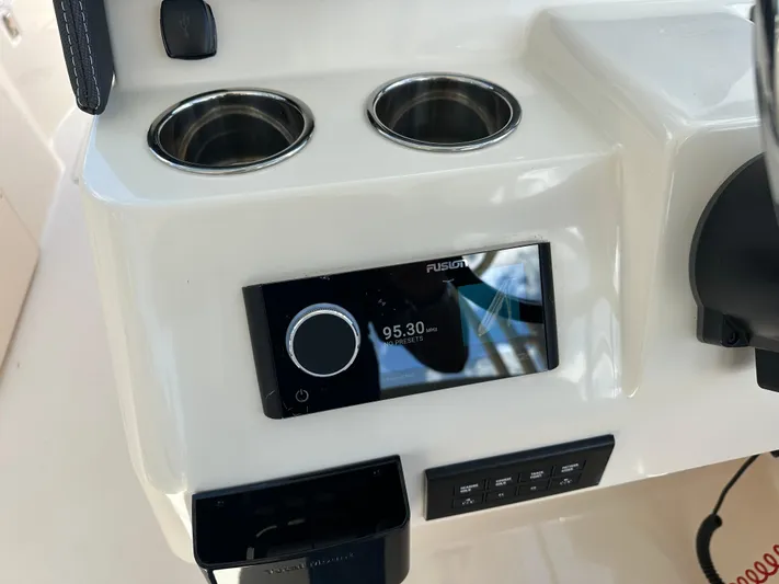  Yacht Photos Pics 2024 Grady-White Freedom 285 boat dashboard with Fusion stereo and cup holders.