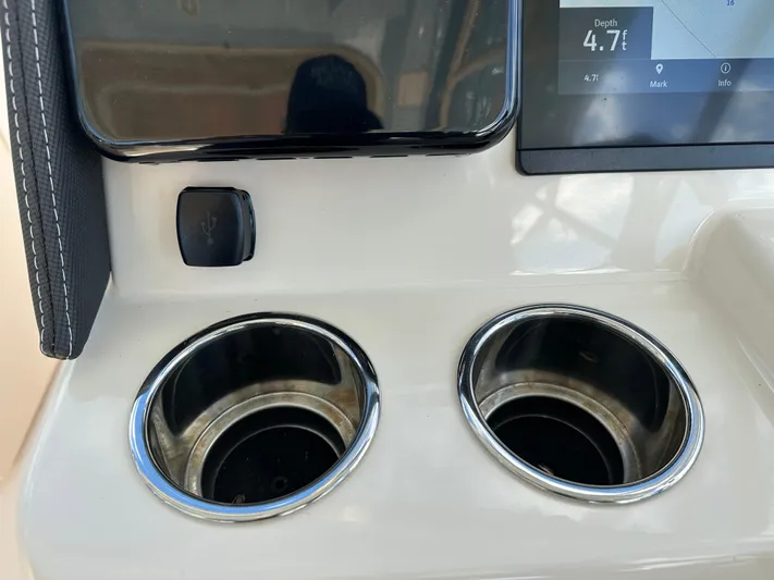  Yacht Photos Pics Dashboard of 2024 Grady-White Freedom 285 with cup holders and USB port.