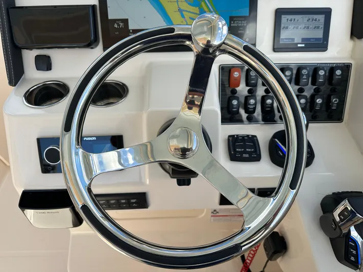  Yacht Photos Pics Steering wheel and dashboard of 2024 Grady-White Freedom 285 boat.
