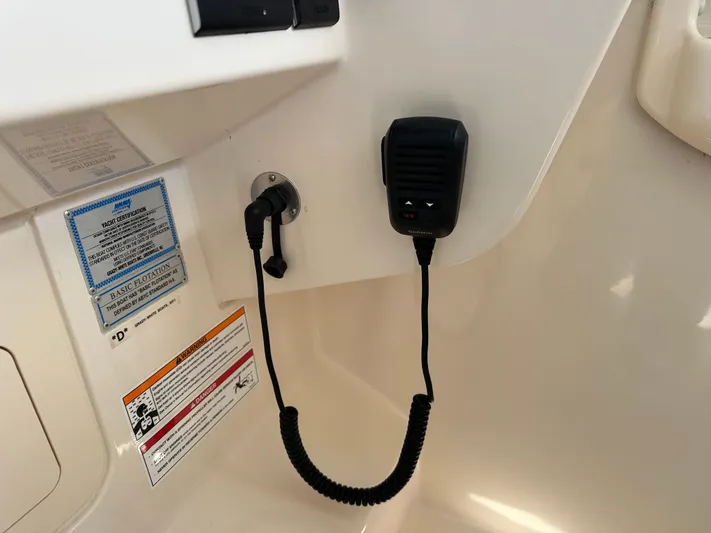  Yacht Photos Pics 2024 Grady-White Freedom 285 boat interior with communication device and safety labels.