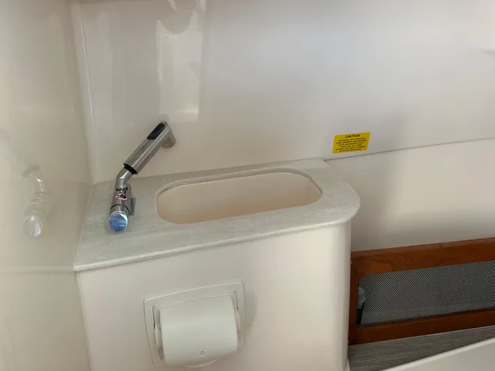 Yacht Photos Pics 2024 Grady-White Freedom 285 boat interior with sink and faucet.