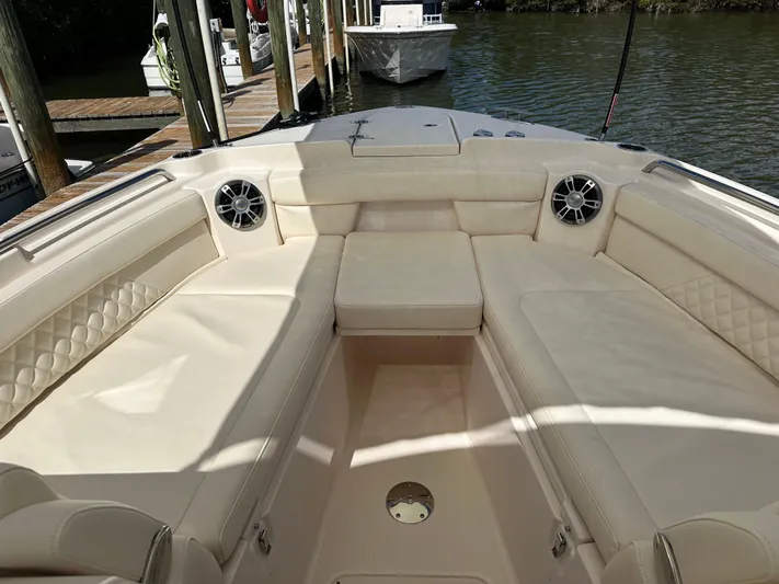  Yacht Photos Pics 2024 Grady-White Freedom 285 boat interior with spacious seating and speakers.