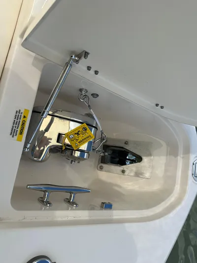  Yacht Photos Pics 2024 Grady-White Freedom 285 boat anchor compartment with caution label and chrome fittings.