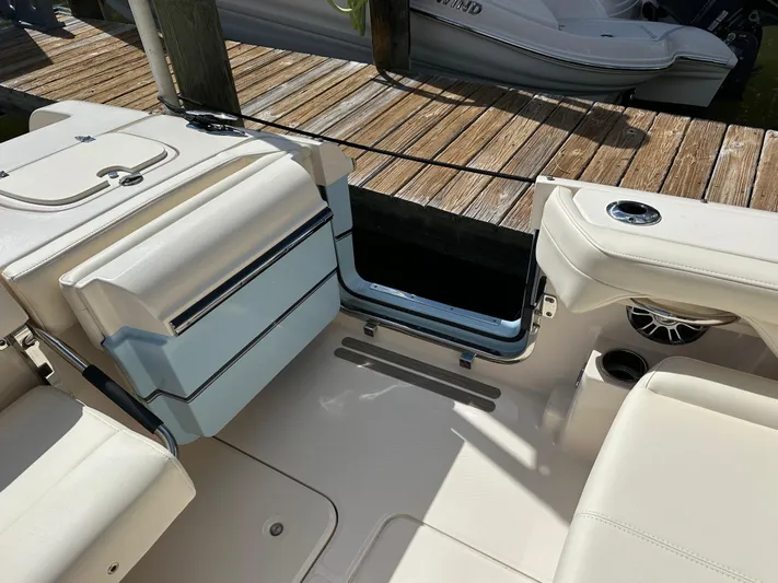  Yacht Photos Pics 2024 Grady-White Freedom 285 boat interior with seating and dock view.