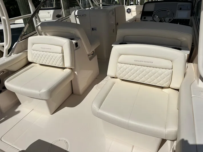  Yacht Photos Pics 2024 Grady-White Freedom 285 boat interior with luxurious white seating.