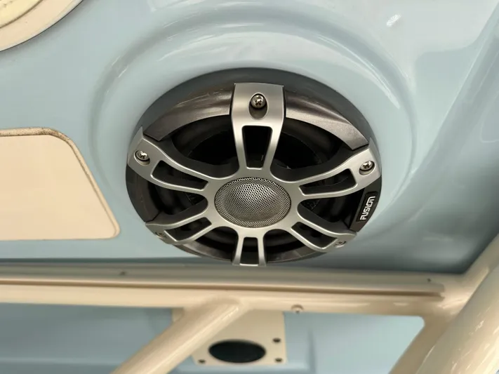  Yacht Photos Pics 2024 Grady-White Freedom 285 boat speaker, Fusion brand, mounted on light blue surface.