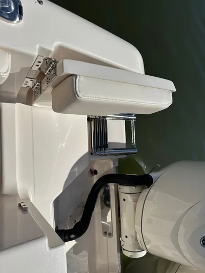  Yacht Photos Pics 2024 Grady-White Freedom 285 boat with a foldable swim ladder and engine detail.