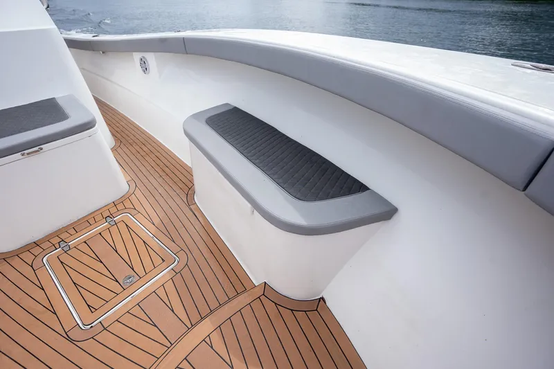  Yacht Photos Pics 2023 Seahorse 36 CC boat deck with cushioned seating and wood finish.