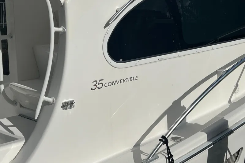  Yacht Photos Pics 2008 Luhrs 35 Convertible boat exterior with sleek design and window detail.