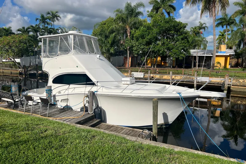  Yacht Photos Pics 2008 Luhrs 35 Convertible yacht docked by lush tropical scenery.