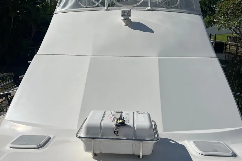  Yacht Photos Pics 2008 Luhrs 35 Convertible boat deck with safety equipment and clear sky.