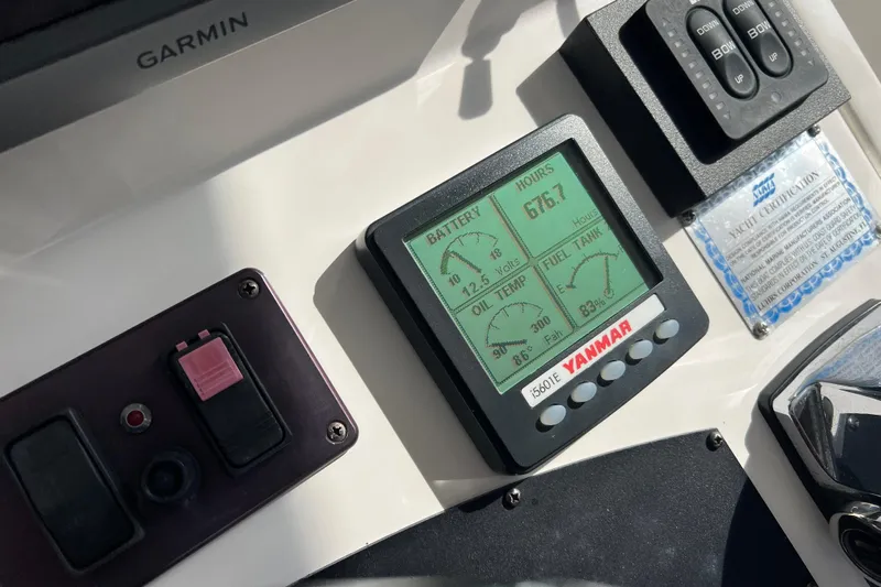  Yacht Photos Pics Yanmar engine display on 2008 Luhrs 35 Convertible boat dashboard with Garmin equipment.