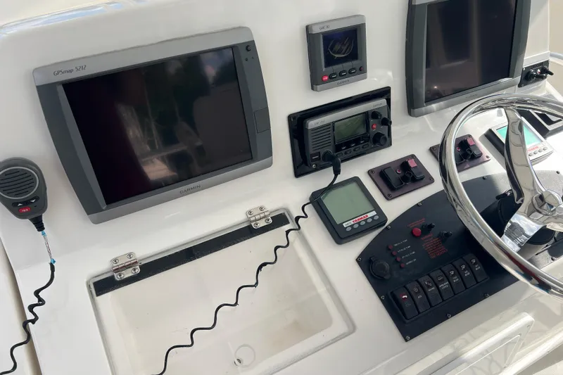  Yacht Photos Pics Control panel of 2008 Luhrs 35 Convertible boat with Garmin GPS and navigation equipment.