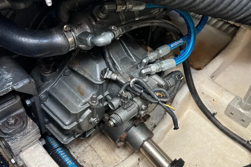  Yacht Photos Pics Engine compartment of a 2008 Luhrs 35 Convertible boat, showing mechanical components and hoses.