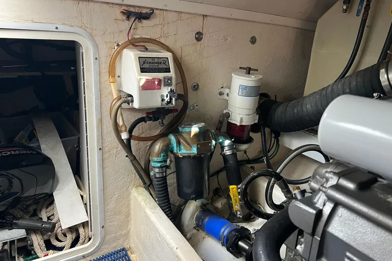  Yacht Photos Pics Engine room of 2008 Luhrs 35 Convertible boat with oil changer system and hoses.