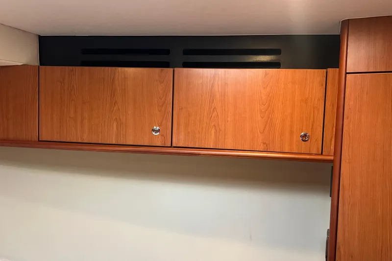 Yacht Photos Pics Wooden cabinets inside 2008 Luhrs 35 Convertible boat interior.