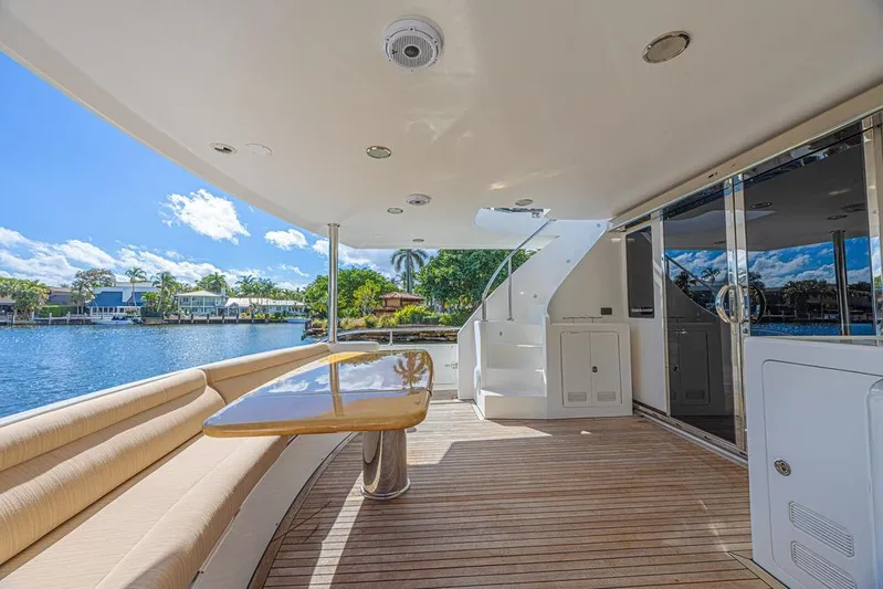 Margarita Yacht Photos Pics Luxurious 2010 Ocean Alexander 74 Motoryacht deck with seating and scenic waterfront view.