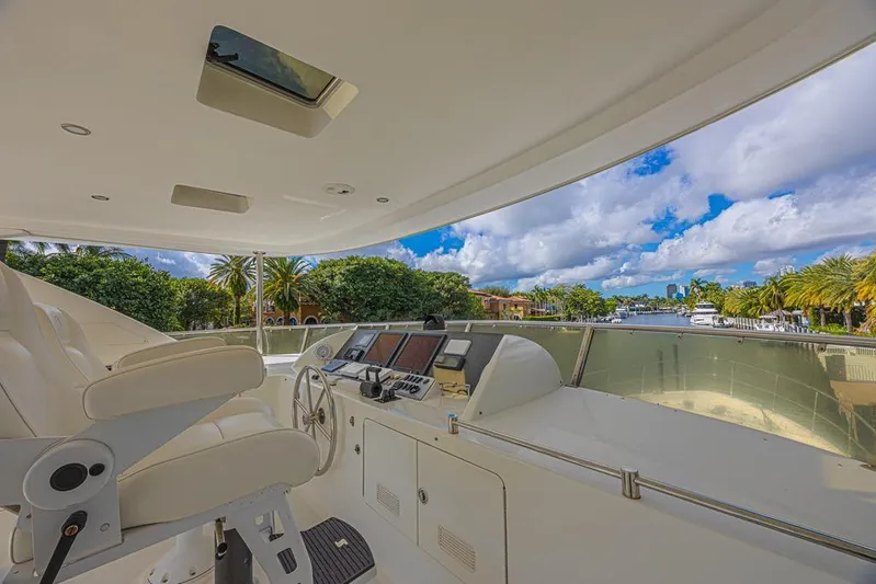 Margarita Yacht Photos Pics Luxurious helm of 2010 Ocean Alexander 74 Motoryacht with scenic waterfront view.