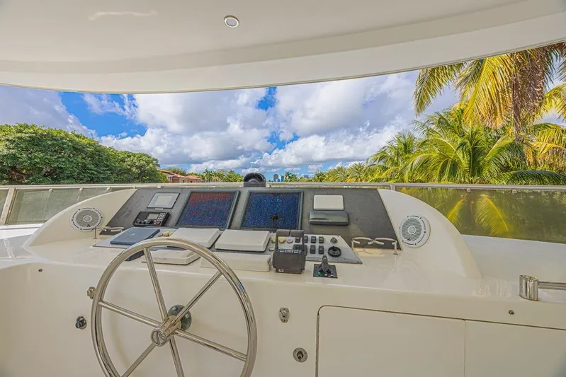 Margarita Yacht Photos Pics Cockpit view of 2010 Ocean Alexander 74 Motoryacht with lush tropical backdrop.