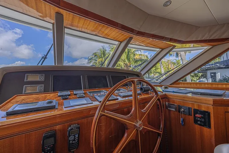 Margarita Yacht Photos Pics Cockpit of 2010 Ocean Alexander 74 Motoryacht with wooden steering wheel and navigation instruments.