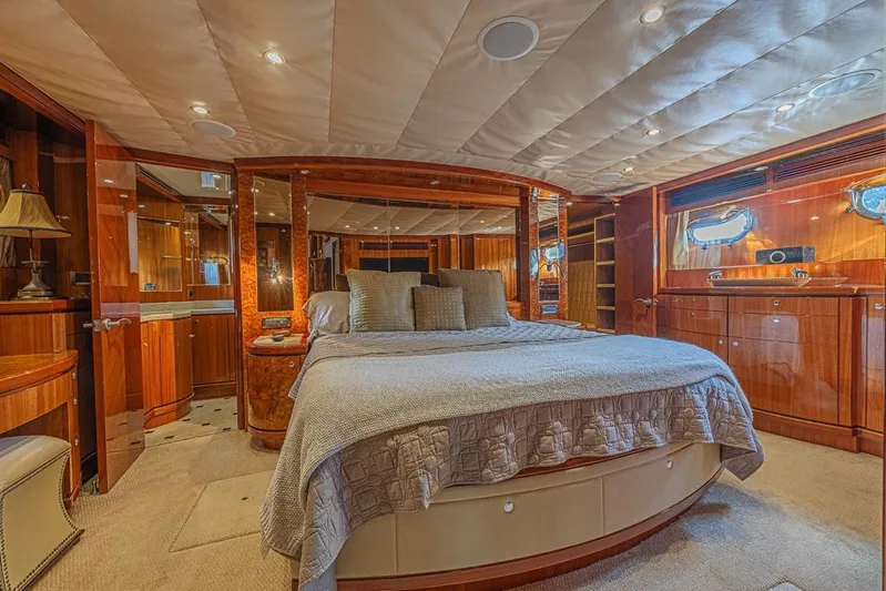 Margarita Yacht Photos Pics Luxurious bedroom interior of 2010 Ocean Alexander 74 Motoryacht with elegant wood finishes.