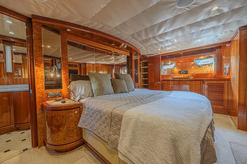 Margarita Yacht Photos Pics Luxurious bedroom interior of 2010 Ocean Alexander 74 Motoryacht with elegant wood finishes.