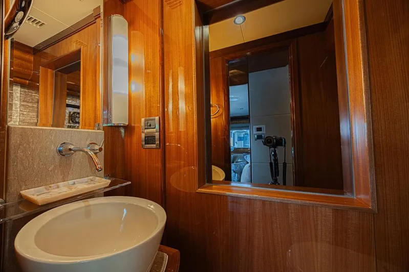 Margarita Yacht Photos Pics Luxurious bathroom interior of 2010 Ocean Alexander 74 Motoryacht with elegant wood finish.