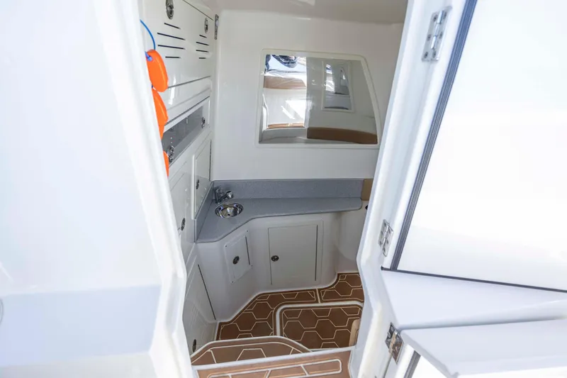  Yacht Photos Pics Interior of 2020 Blackwater 41 Tournament boat with sink and storage cabinets.