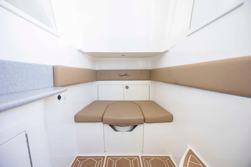  Yacht Photos Pics 2020 Blackwater 41 Tournament cabin interior with beige seating and white walls.