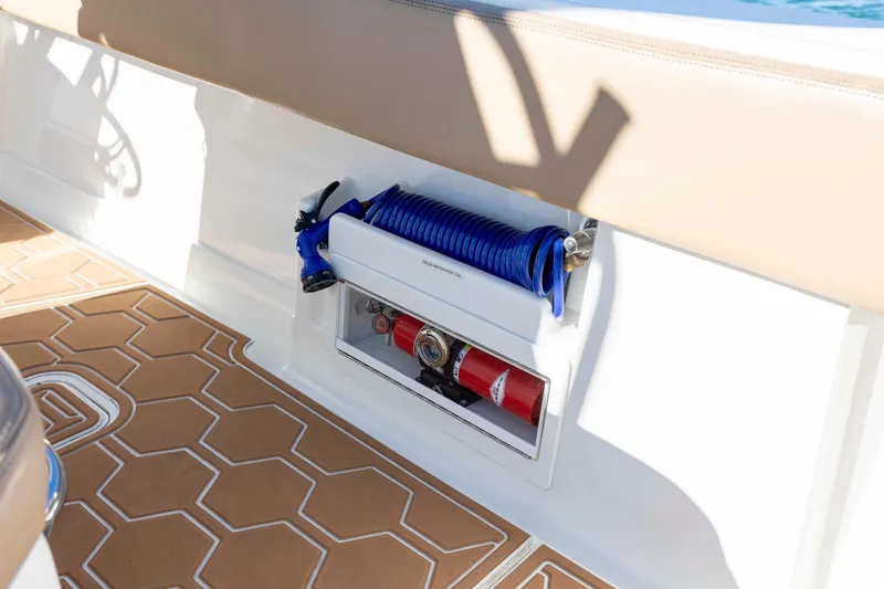  Yacht Photos Pics 2020 Blackwater 41 Tournament boat interior with coiled blue hose and fire extinguisher.