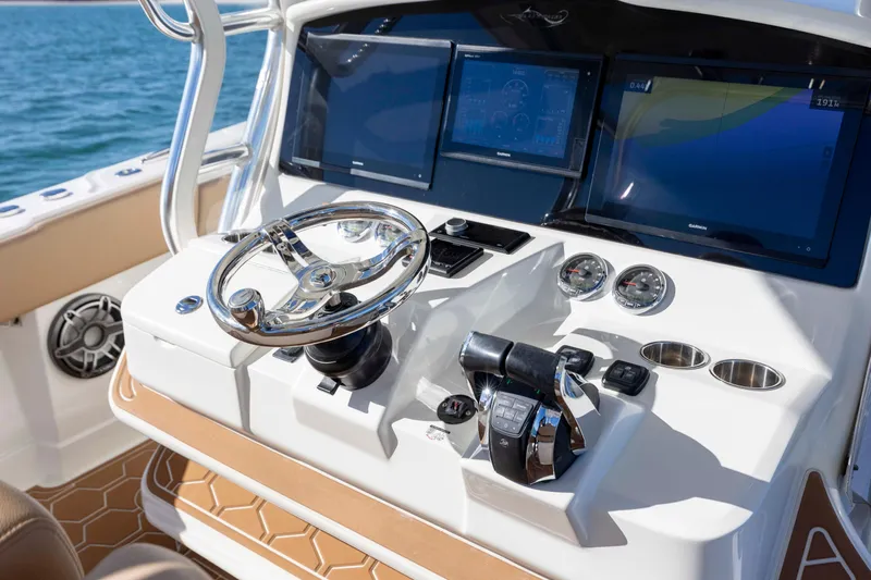  Yacht Photos Pics Control panel of 2020 Blackwater 41 Tournament boat with steering wheel and digital displays.