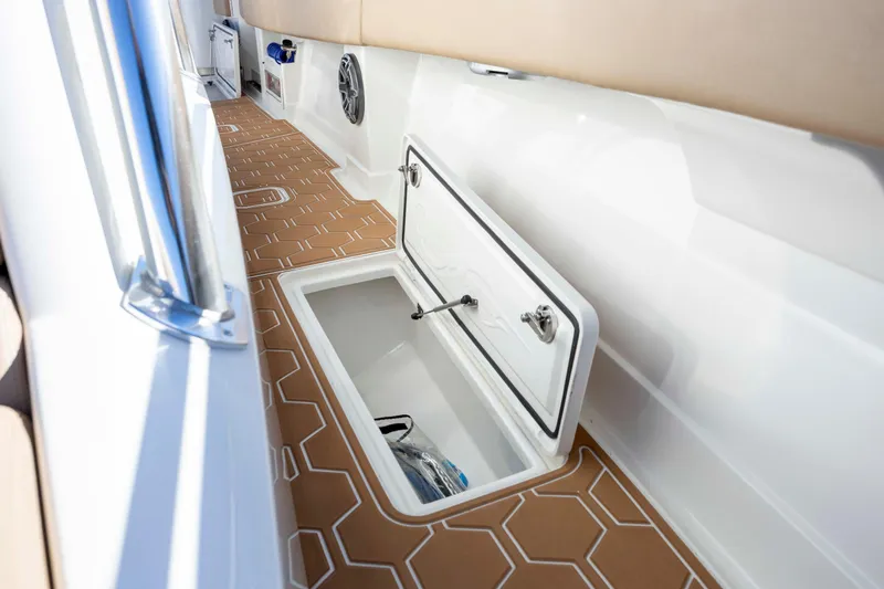  Yacht Photos Pics 2020 Blackwater 41 Tournament boat interior with open storage compartment and patterned flooring.