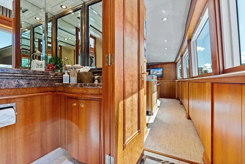 Picosa Lady Yacht Photos Pics Luxurious interior of 2001 West Bay 103 Sonship yacht with elegant wood finishes and large windows.