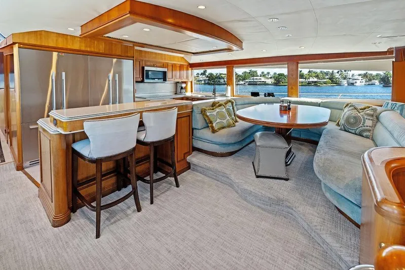Picosa Lady Yacht Photos Pics Luxurious interior of 2001 West Bay 103 Sonship yacht with elegant seating and dining area.