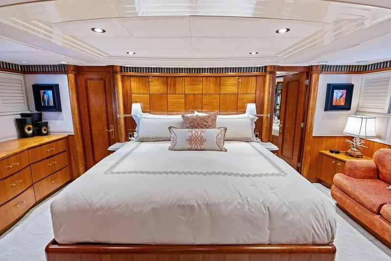 Picosa Lady Yacht Photos Pics Luxurious bedroom interior of 2001 West Bay 103 Sonship yacht with elegant wood finishes.