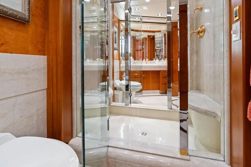 Picosa Lady Yacht Photos Pics Luxurious bathroom in 2001 West Bay 103 Sonship yacht with glass shower and elegant fixtures.