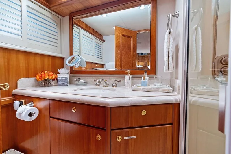 Picosa Lady Yacht Photos Pics Luxurious bathroom in 2001 West Bay 103 Sonship yacht with elegant wood cabinetry.