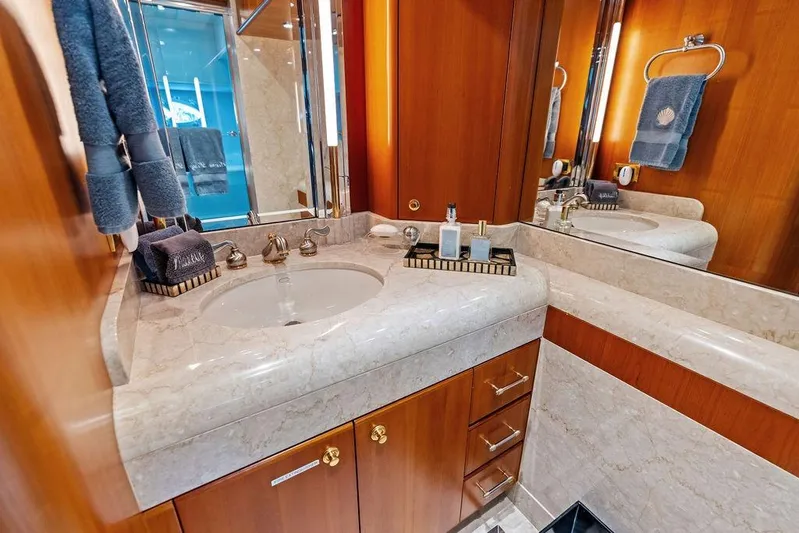 Picosa Lady Yacht Photos Pics Luxurious bathroom in 2001 West Bay 103 Sonship yacht with marble countertop and elegant fixtures.
