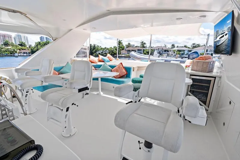 Picosa Lady Yacht Photos Pics Luxurious 2001 West Bay 103 Sonship yacht interior with plush seating and scenic water views.