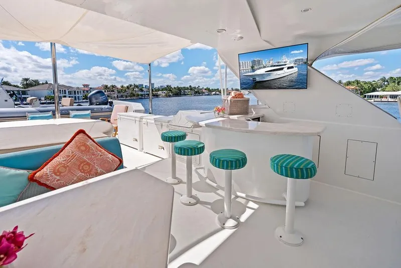 Picosa Lady Yacht Photos Pics Luxurious 2001 West Bay 103 Sonship yacht interior with bar stools and waterfront view.